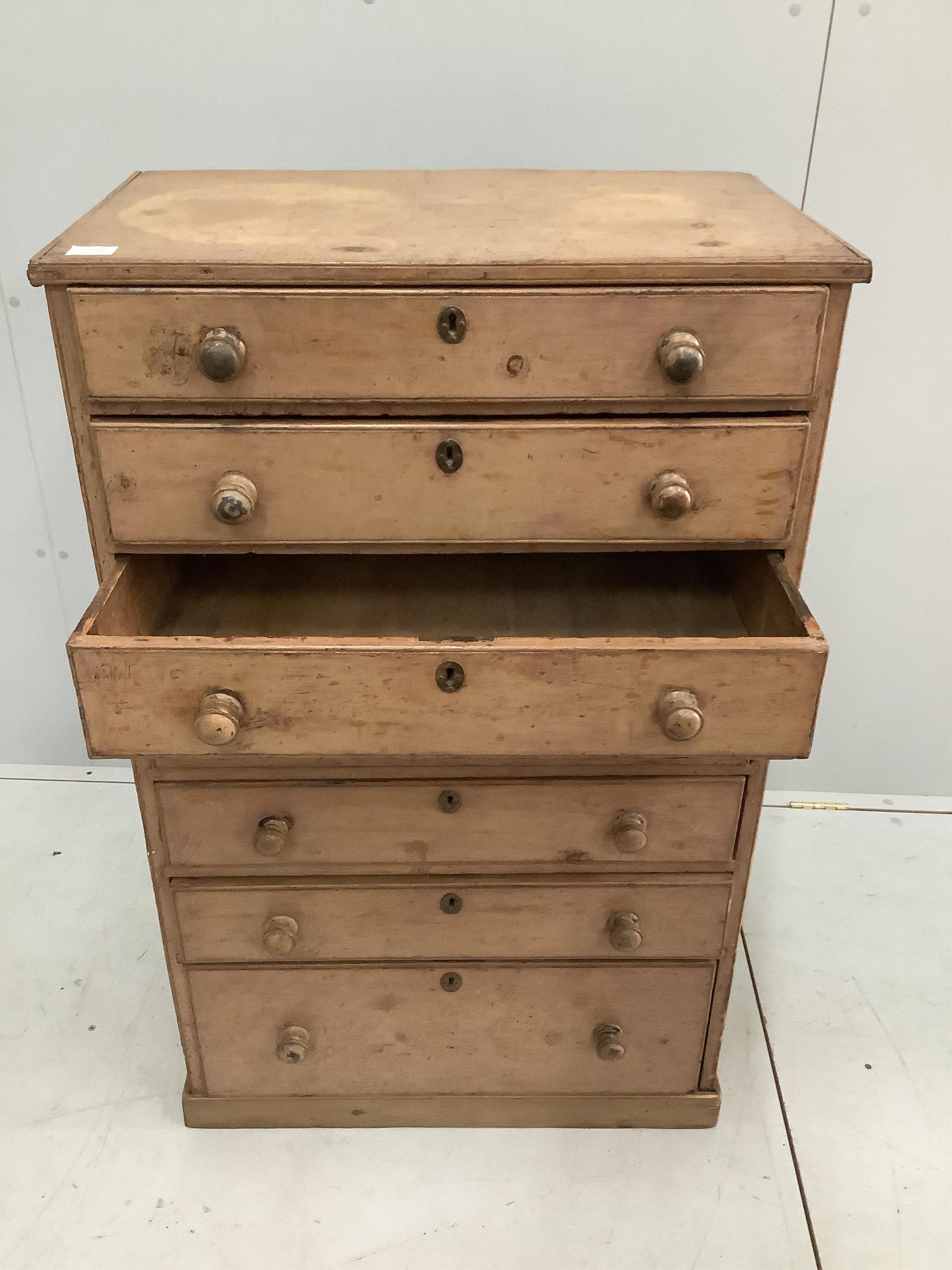 A French mid 19th century painted pine narrow chest of seven drawers, width 73cm, depth 44cm, height 117cm. Condition - fair